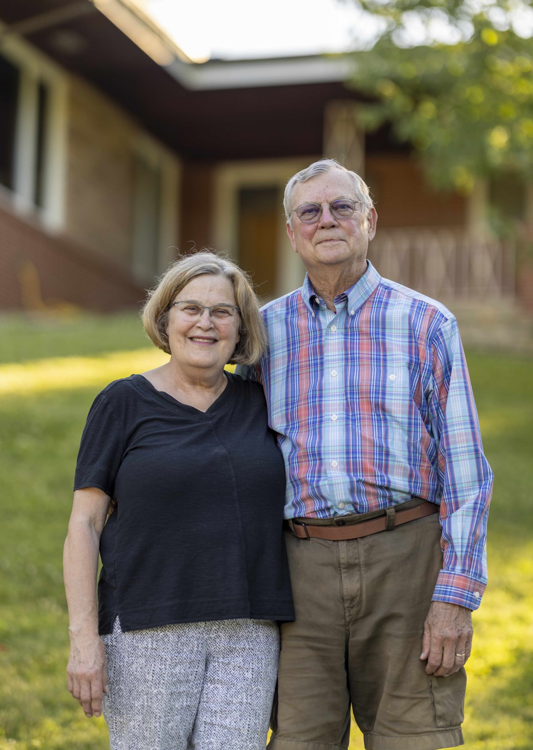 Mark and Thayla Hanson in front of home